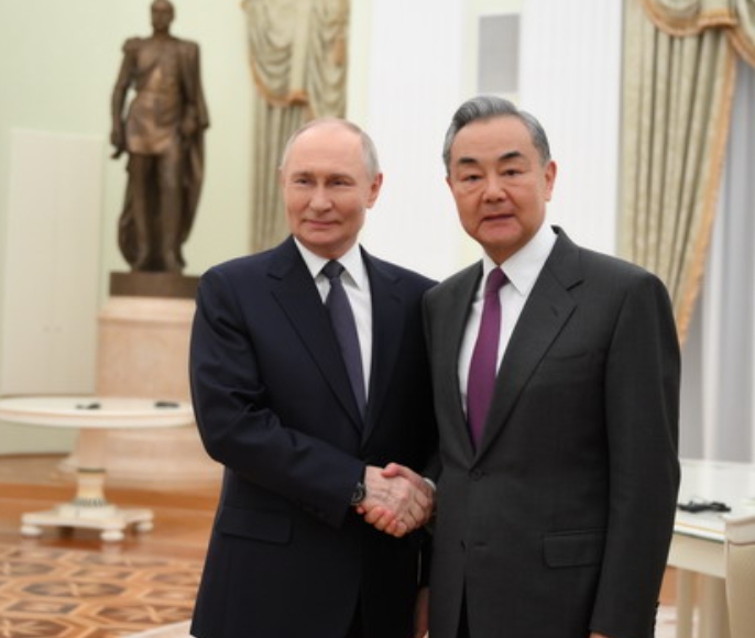 Russian President Putin meets with visiting Chinese FM
