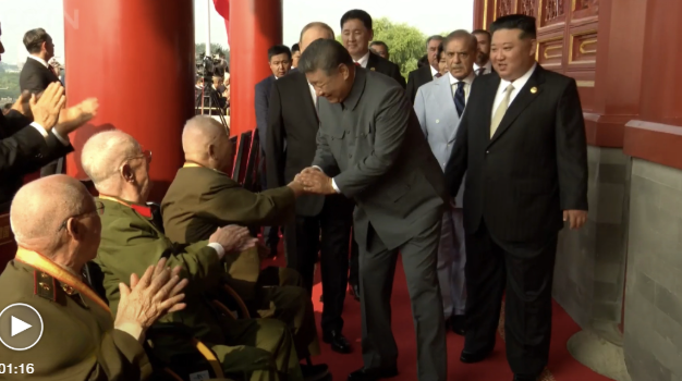 President Xi Jinping greets veterans on Tian'anmen Rostrum